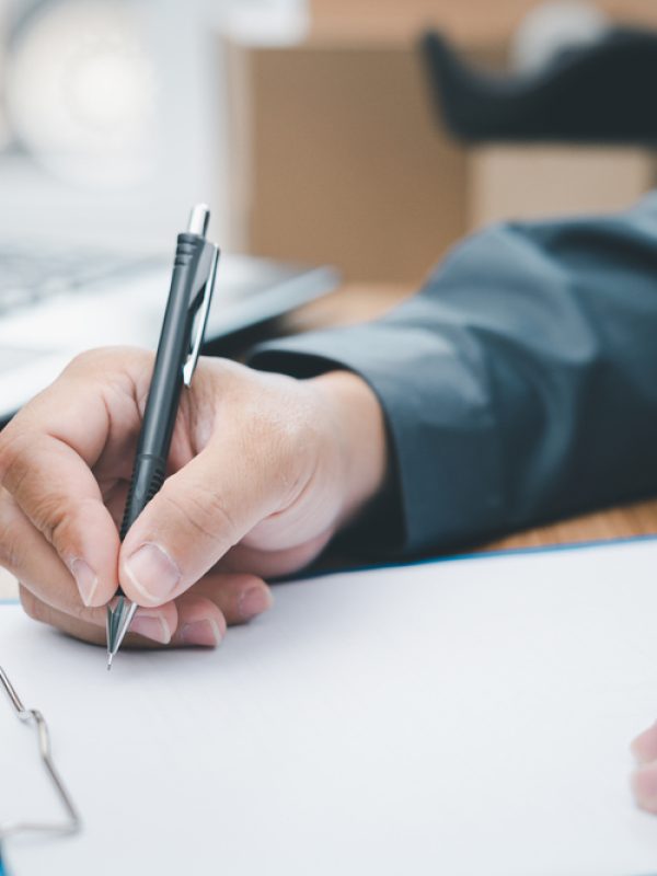 A,Man,Checking,The,Delivery,List,And,Writing,On,The